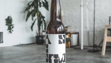 a-photo-of-a-beer-bottle-placed-on-a-woo_OXTgBHOzSZCfVCvF_xHT4A_8B6wPRwTRHiDKBWLiRCFdQ